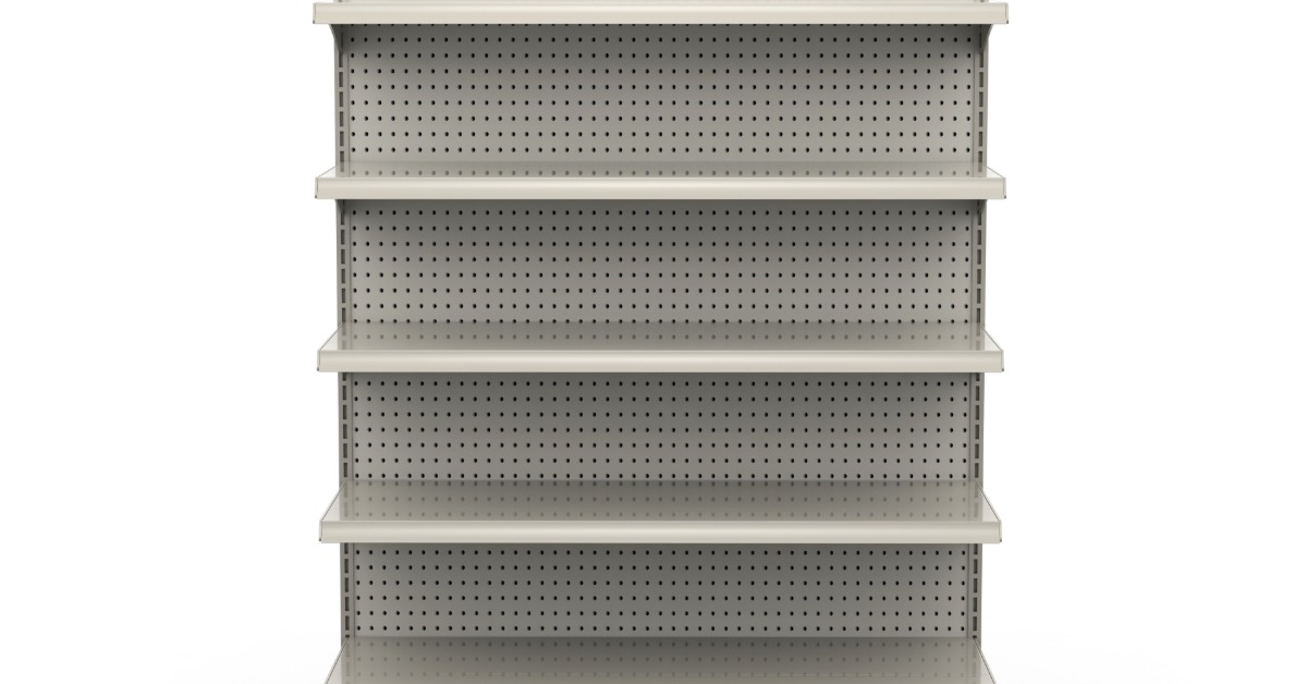 A metal store shelf made for the end of an aisle. The back of the shelving has tiny holes in the metal.